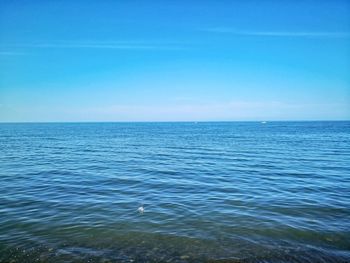 Scenic view of sea against blue sky