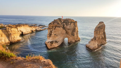 Scenic view of rock formations in water