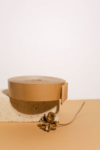 Close-up of drink on table against white background