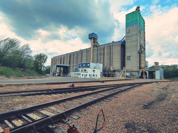 Train on railroad tracks against sky