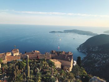 High angle view of buildings and sea against sky