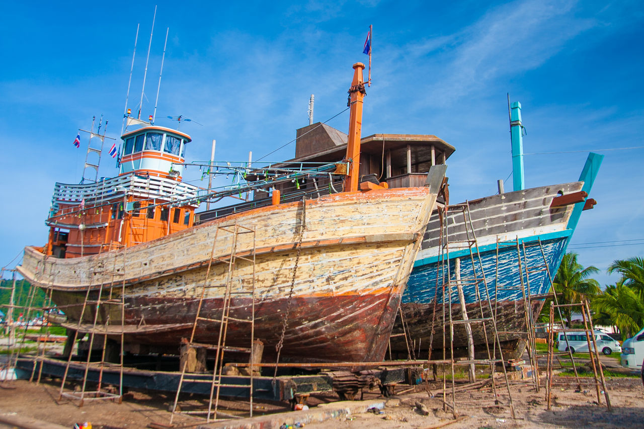 SHIP MOORED AT BEACH