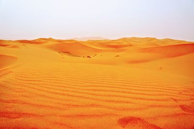 Scenic view of desert against clear sky