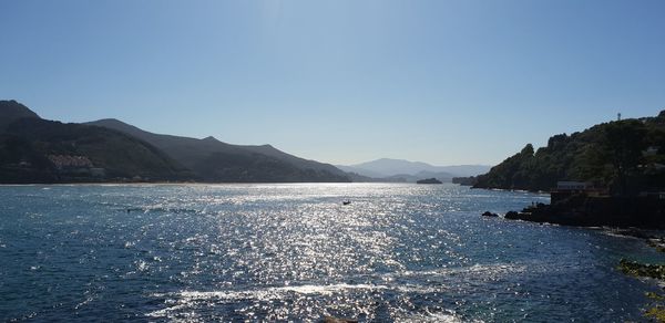 Scenic view of sea against clear blue sky