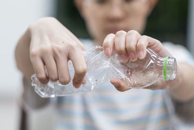 Midsection of man holding ice cream