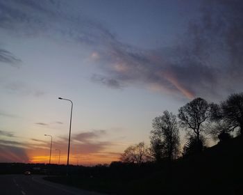 Silhouette of trees against sky at sunset