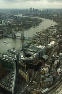 High angle view of city buildings by river