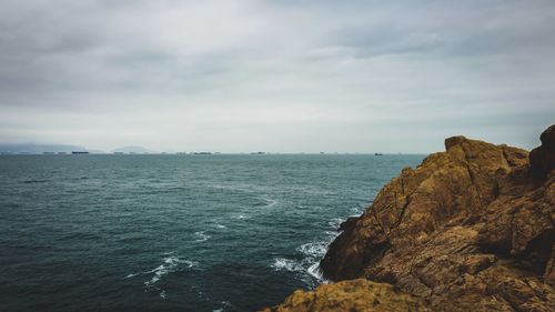 Scenic view of sea and cliff