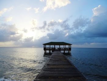 Pier over sea against sky