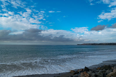 Scenic view of sea against blue sky