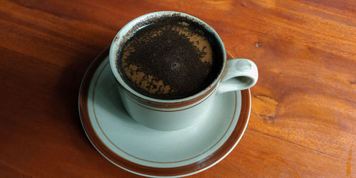 High angle view of coffee on table