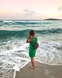 Full length of boy standing on beach