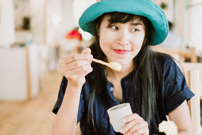 Portrait of smiling man holding ice cream