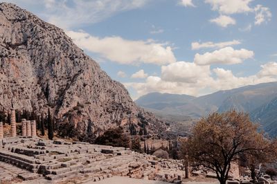 Scenic view of mountains against cloudy sky
