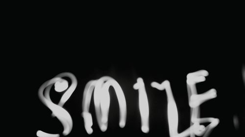 Close-up of lamp over black background