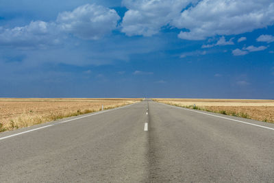 Empty road against sky