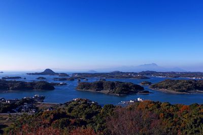 High angle view of sea against blue sky