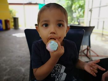 Portrait of boy holding ice cream