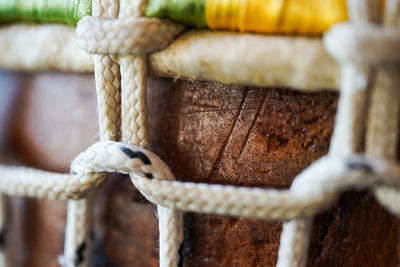 Close-up of rope tied on wooden post