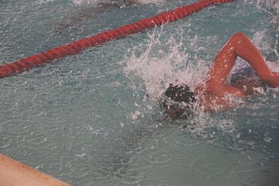 High angle view of man swimming in pool