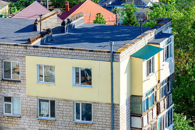 Thermal insulation of an apartment with polystyrene foam  . bituminous roof with chimney