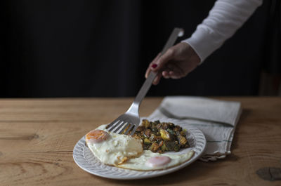 Midsection of man preparing food on table