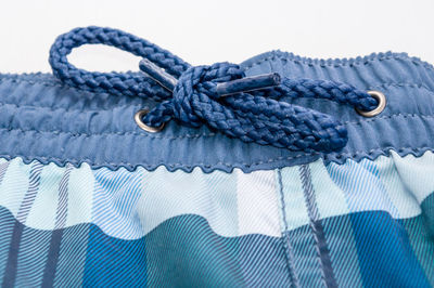 Close-up of rope against white background