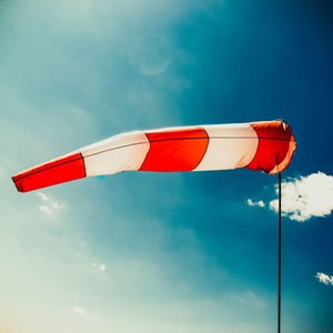 Low angle view of windsock against sky