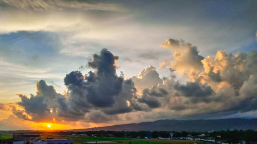 Scenic view of dramatic sky over sea during sunset