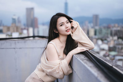 Portrait of young woman looking away