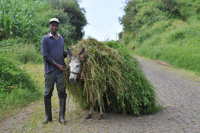 Man standing on dirt road