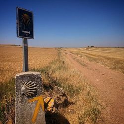 Scenic view of field against blue sky