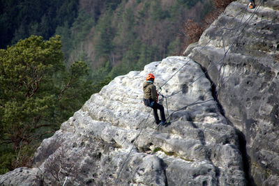 Full length of man climbing on mountain