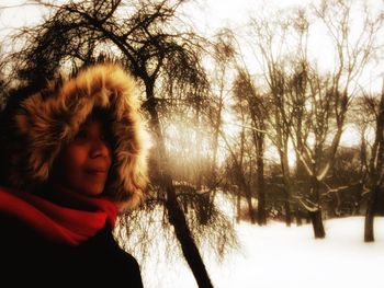 Woman with arms outstretched in background