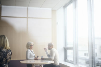 Business people talking during coffee break