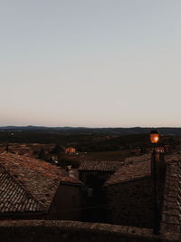 High angle view of buildings in city against clear sky