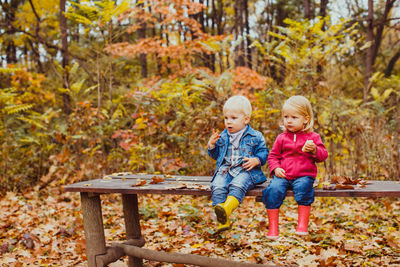 Full length of father and son during autumn