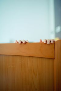 Low angle view of clothes on table against white wall