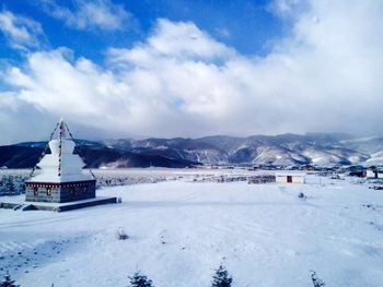 Scenic view of snow covered mountains