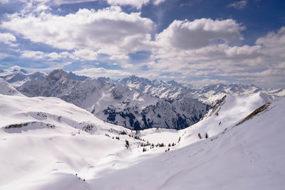 Scenic view of snowcapped mountains against sky