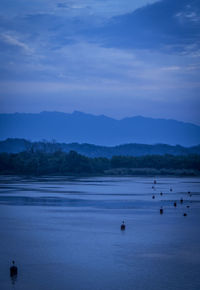 Scenic view of lake against blue sky