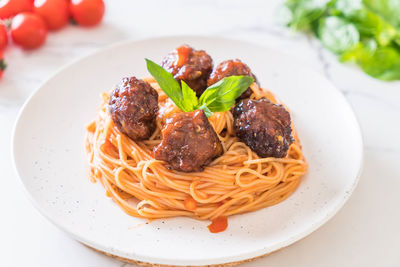 High angle view of pasta in plate on table