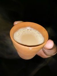 Close-up of hand holding drink