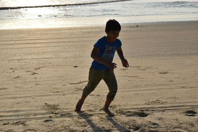 Full length of boy on beach