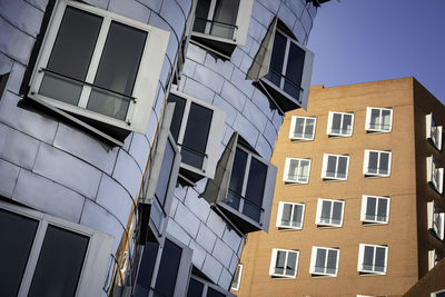 Low angle view of buildings against clear sky