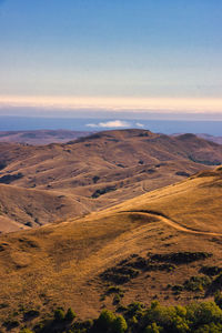 Scenic view of landscape against sky during sunset