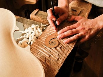 Midsection of man working on table