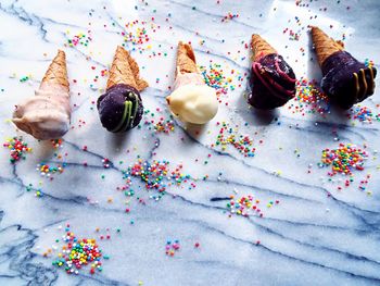 High angle view of multi colored candies on table