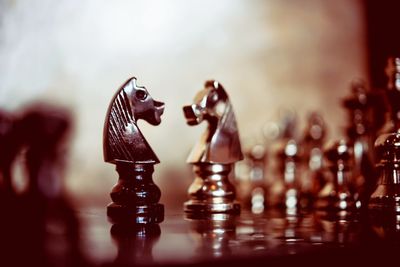 Close-up of chess pieces on table