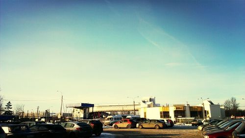 Cars on road against sky